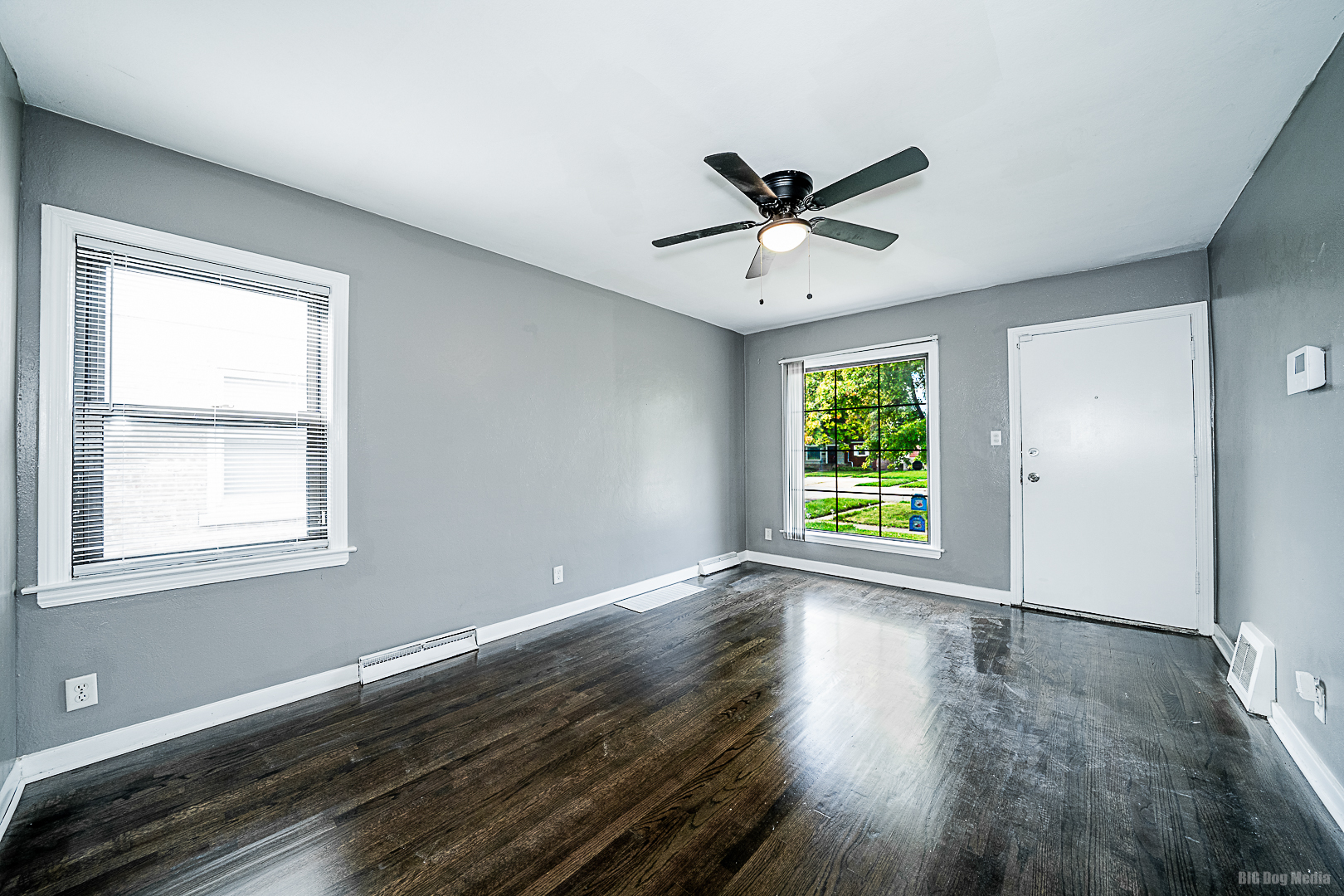 11 167th Street Calumet City, IL 60409 - Photo 5 of 20 a view of empty room with wooden floor and fan