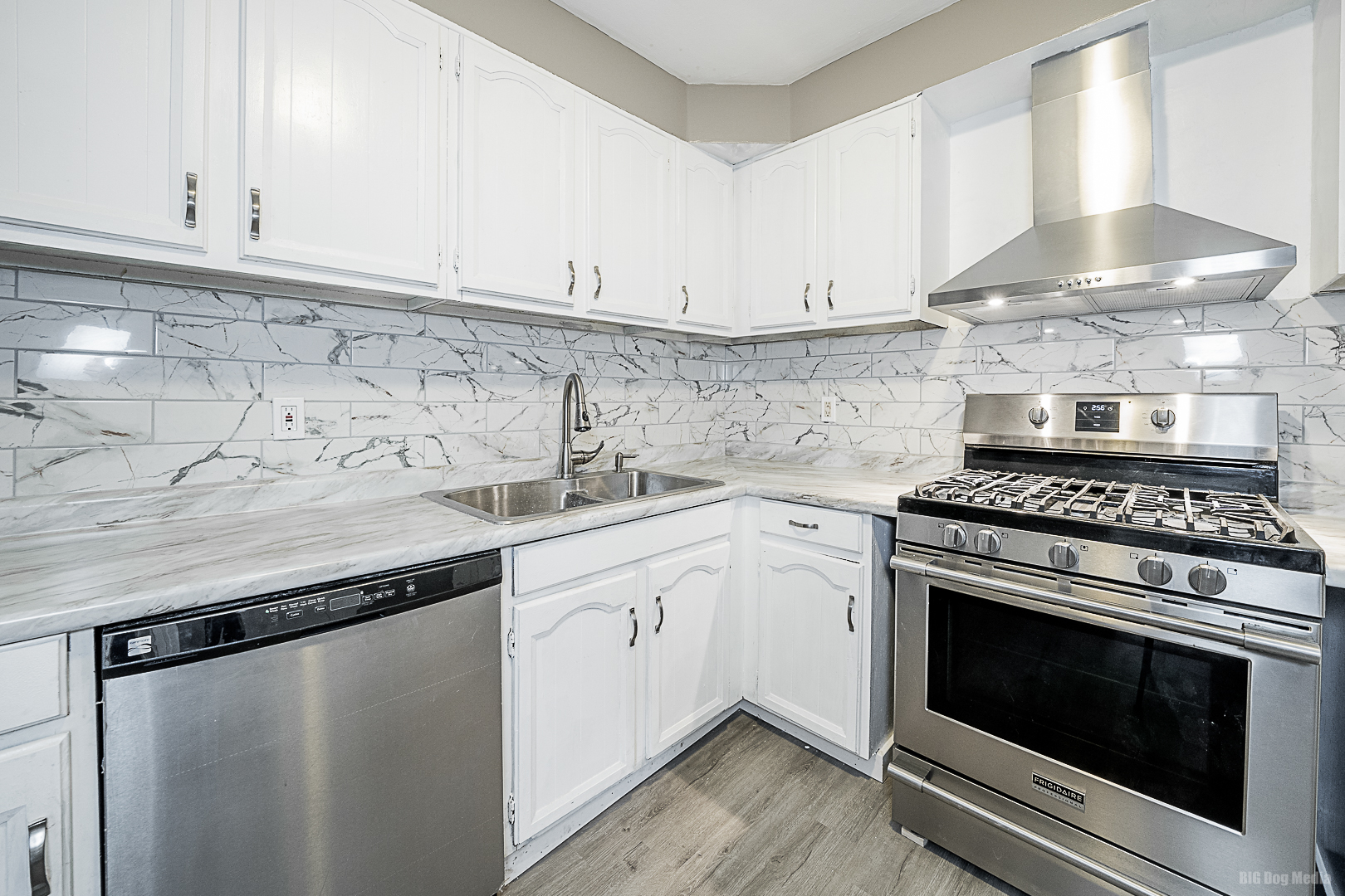 11 167th Street Calumet City, IL 60409 - Photo 9 of 20 a kitchen with granite countertop a stove sink and cabinets