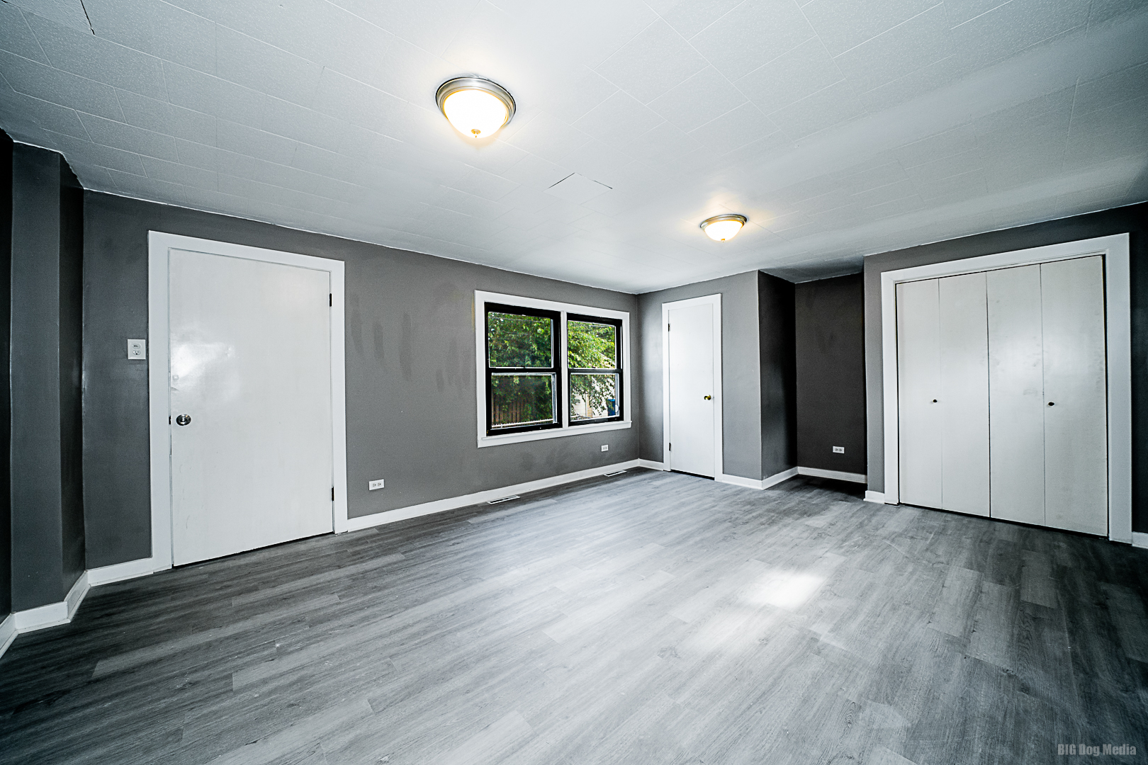 11 167th Street Calumet City, IL 60409 - Photo 10 of 20 an empty room with wooden floor and windows