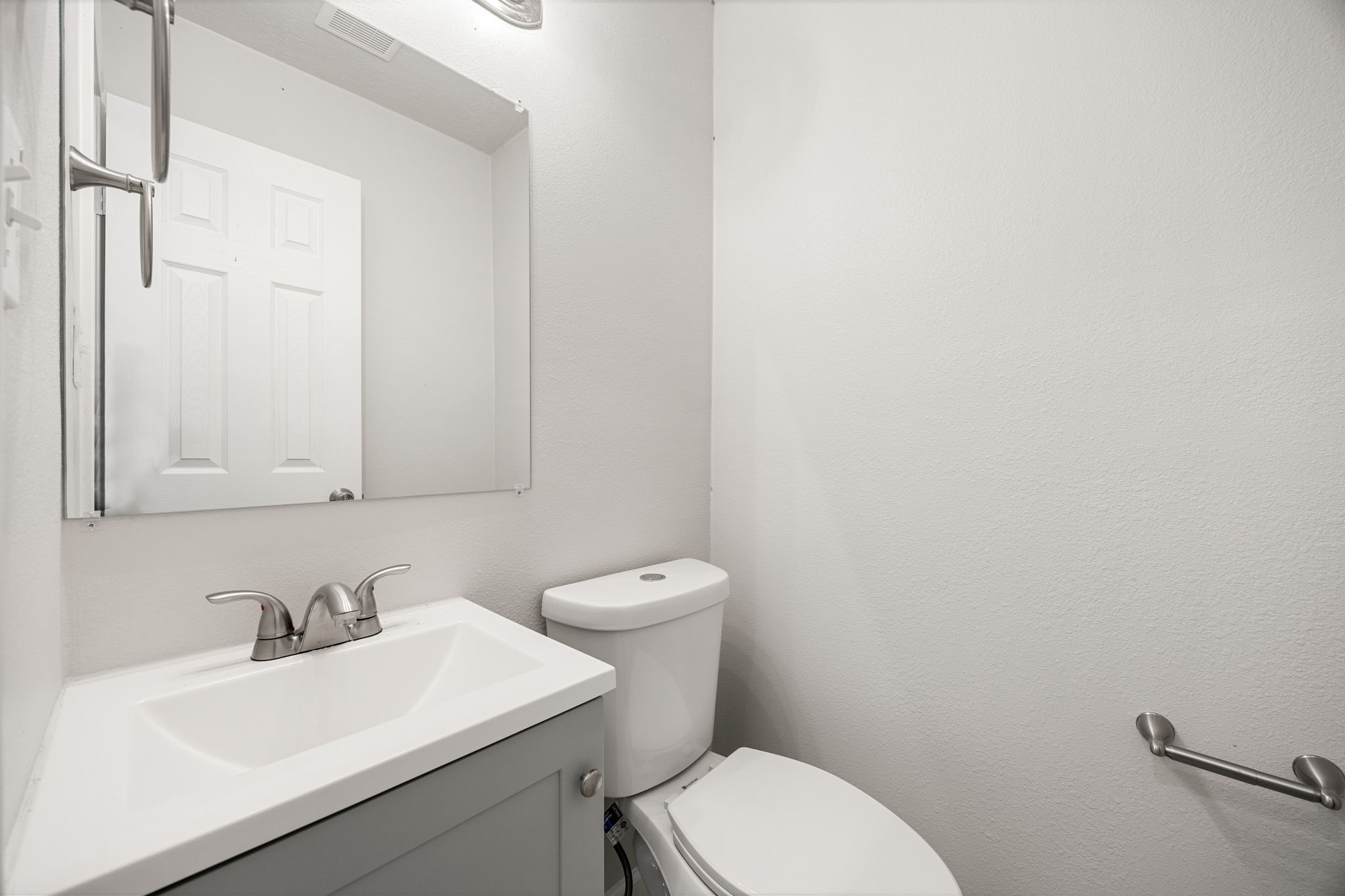 479 Brandon Road Conroe, TX 77302 - Photo 20 of 42 a bathroom with a sink a toilet and mirror