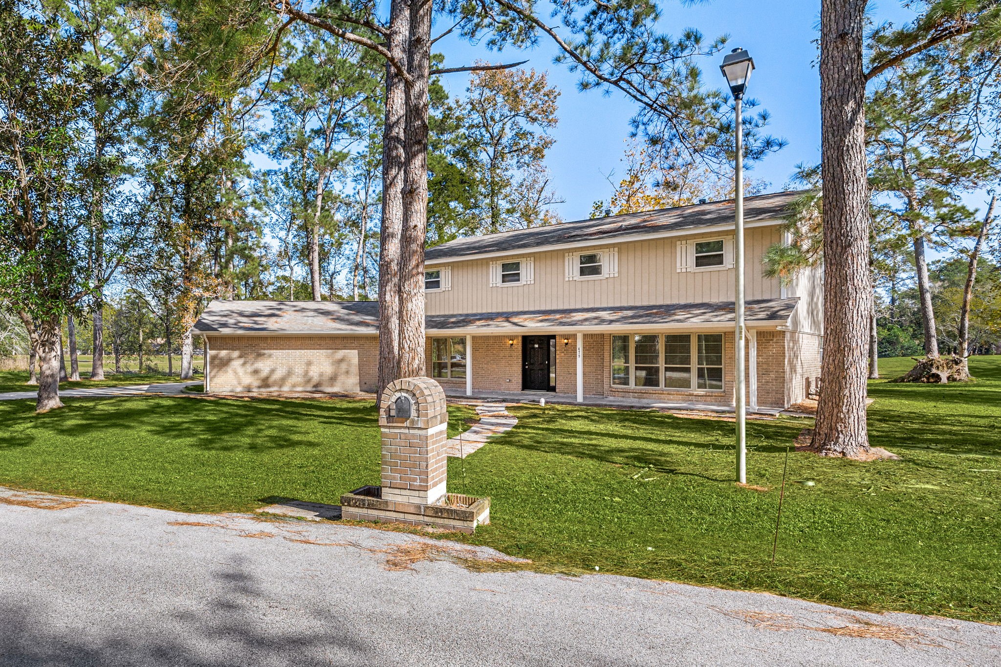 479 Brandon Road Conroe, TX 77302 - Photo 2 of 42 a view of a house with a yard