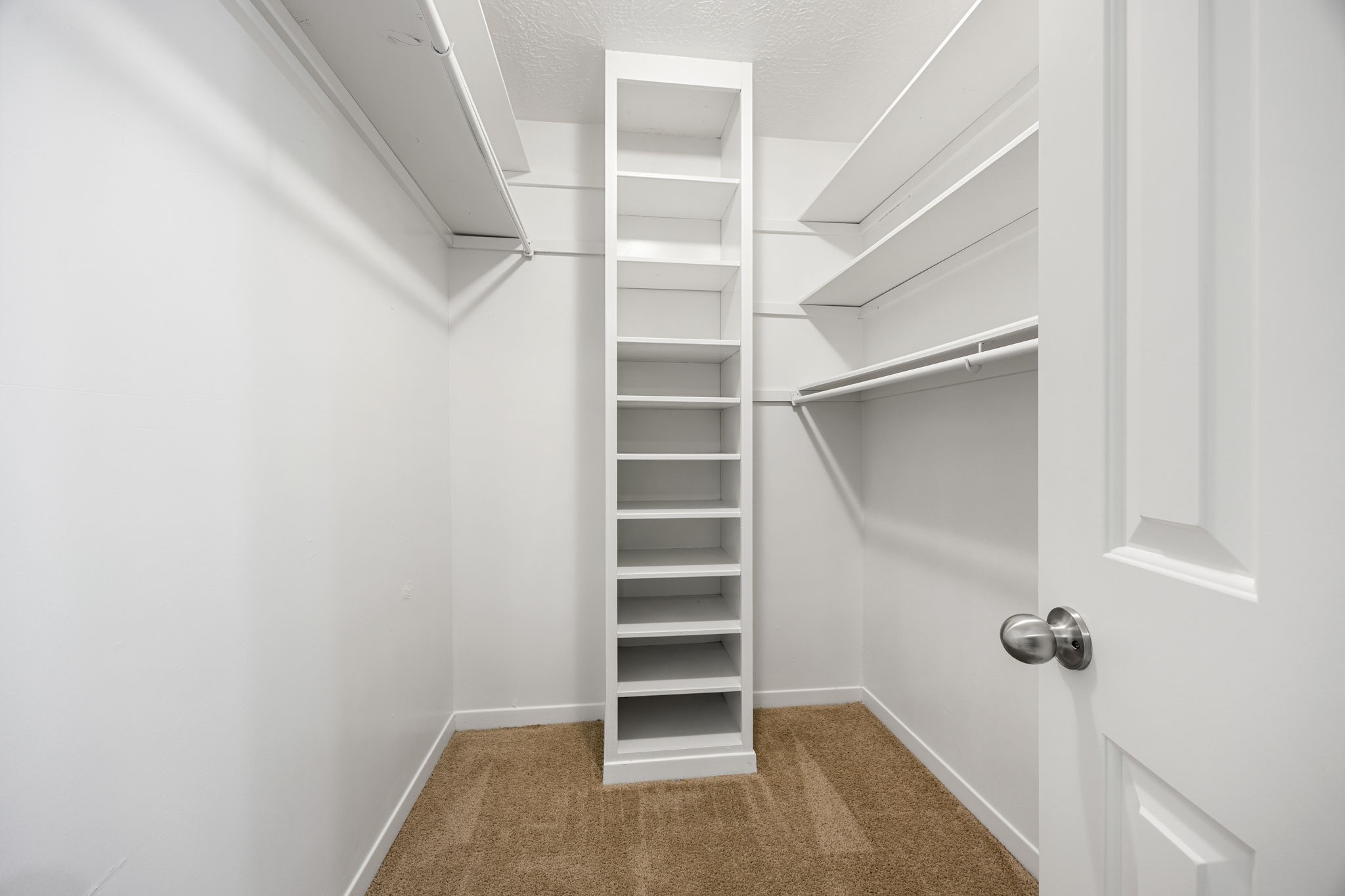 479 Brandon Road Conroe, TX 77302 - Photo 34 of 42 a view of walk in closet with empty racks