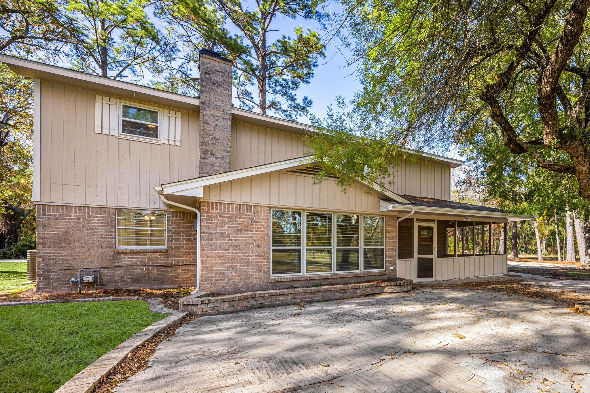 479 Brandon Road Conroe, TX 77302 - Photo 40 of 42 a view of a house with a yard and large tree