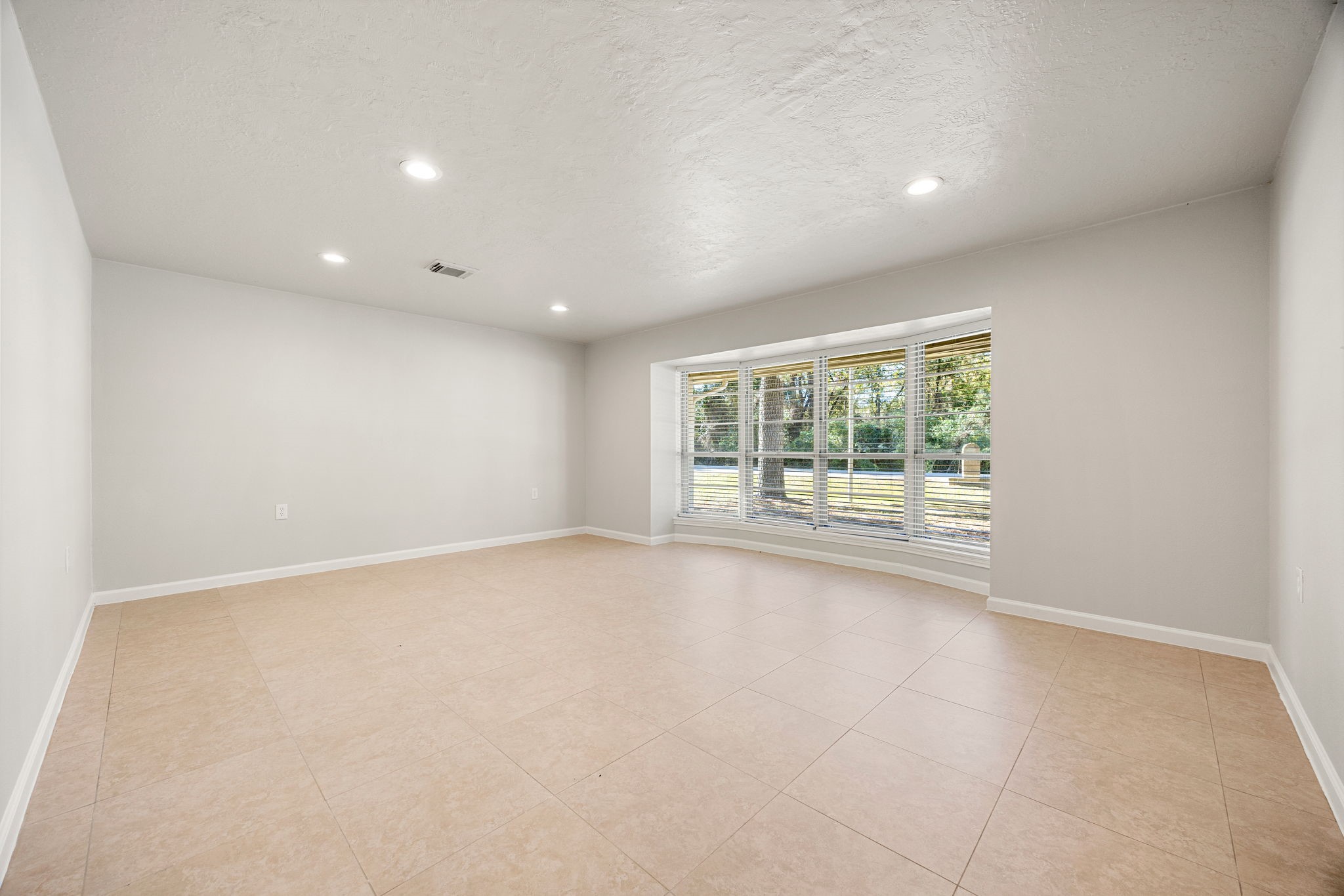 479 Brandon Road Conroe, TX 77302 - Photo 5 of 42 a view of an empty room with a window