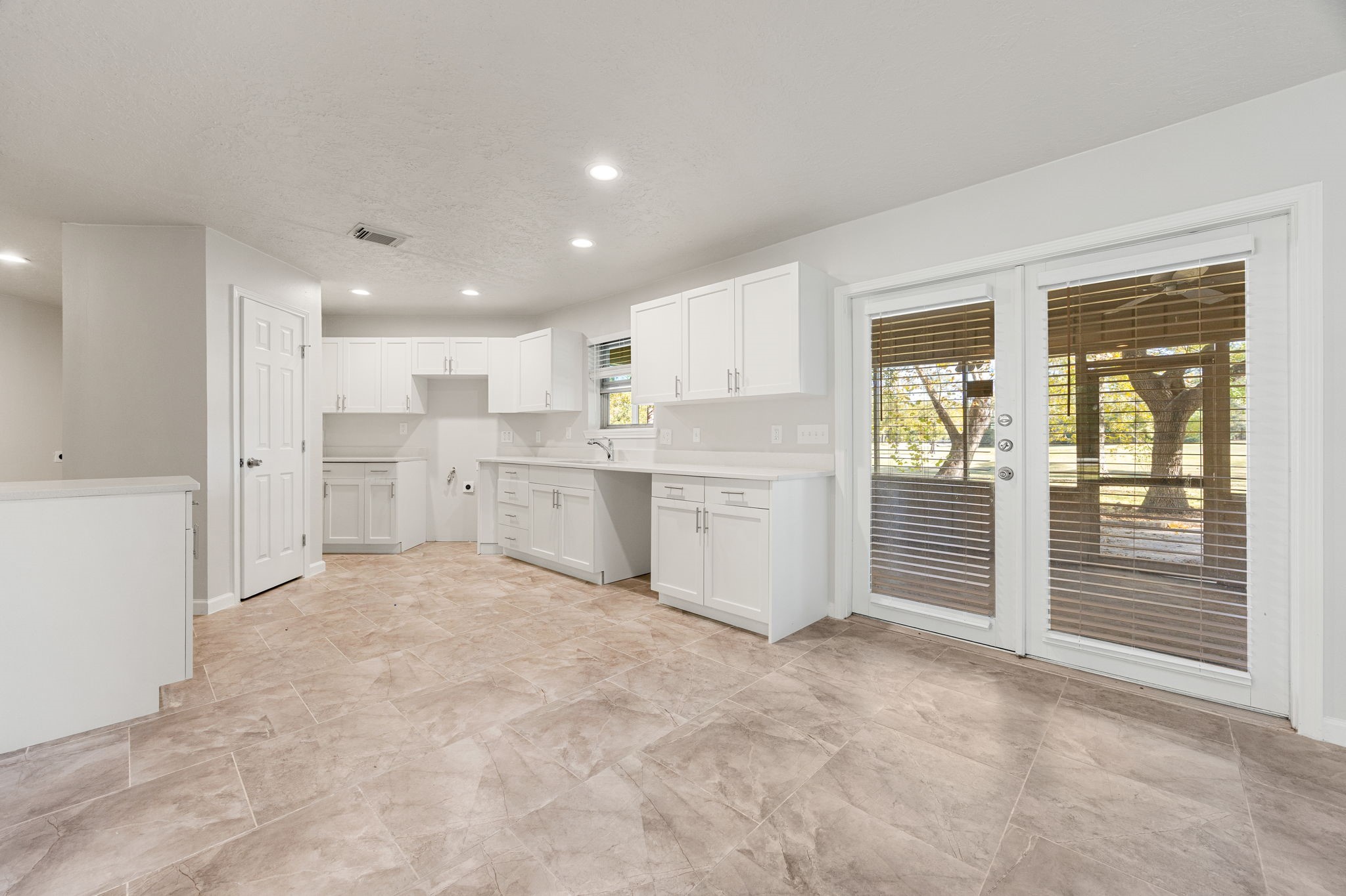 479 Brandon Road Conroe, TX 77302 - Photo 9 of 42 a view of a kitchen with refrigerator and a sink