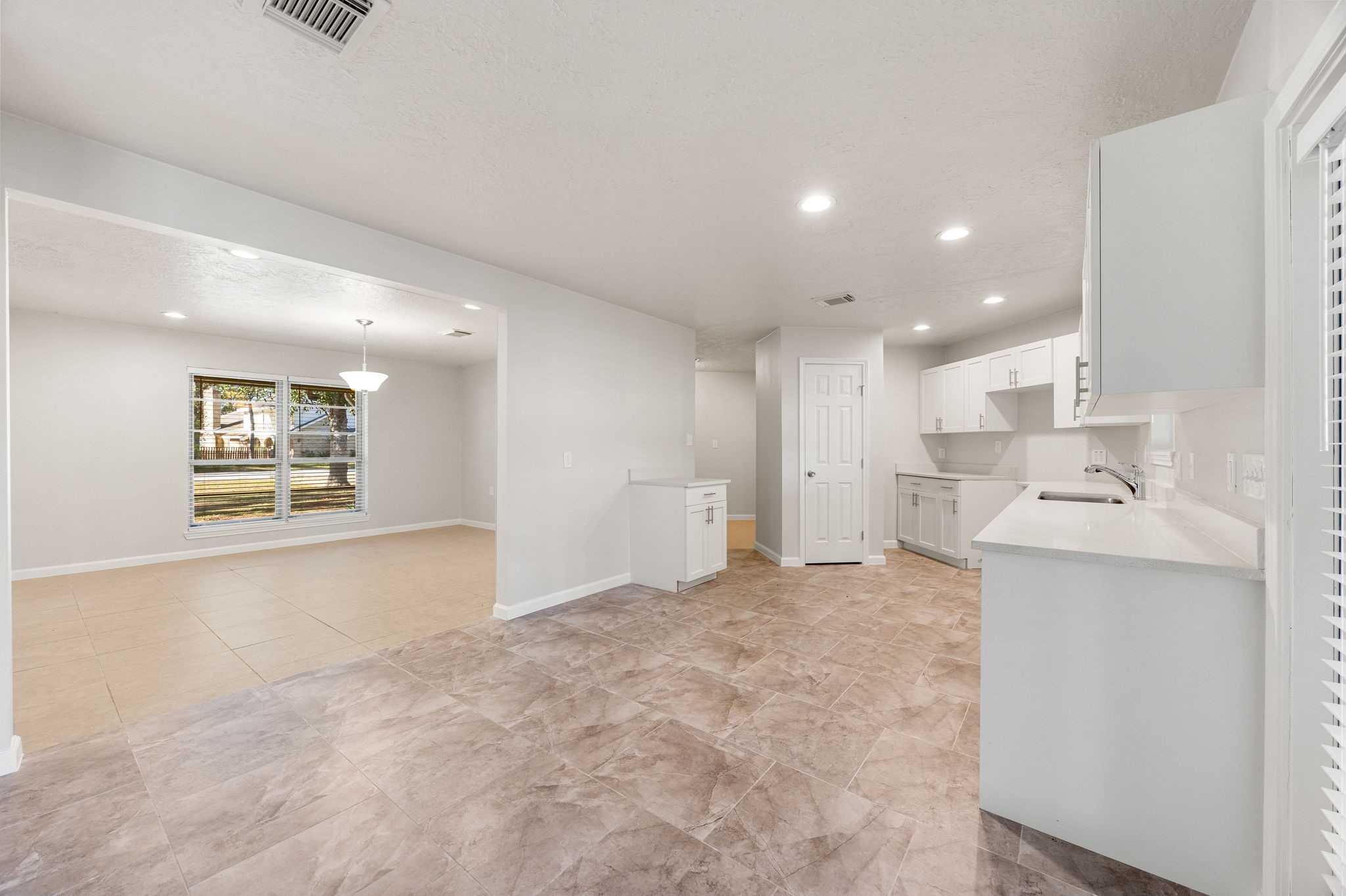 479 Brandon Road Conroe, TX 77302 - Photo 10 of 42 a view of a kitchen with a sink and cabinets
