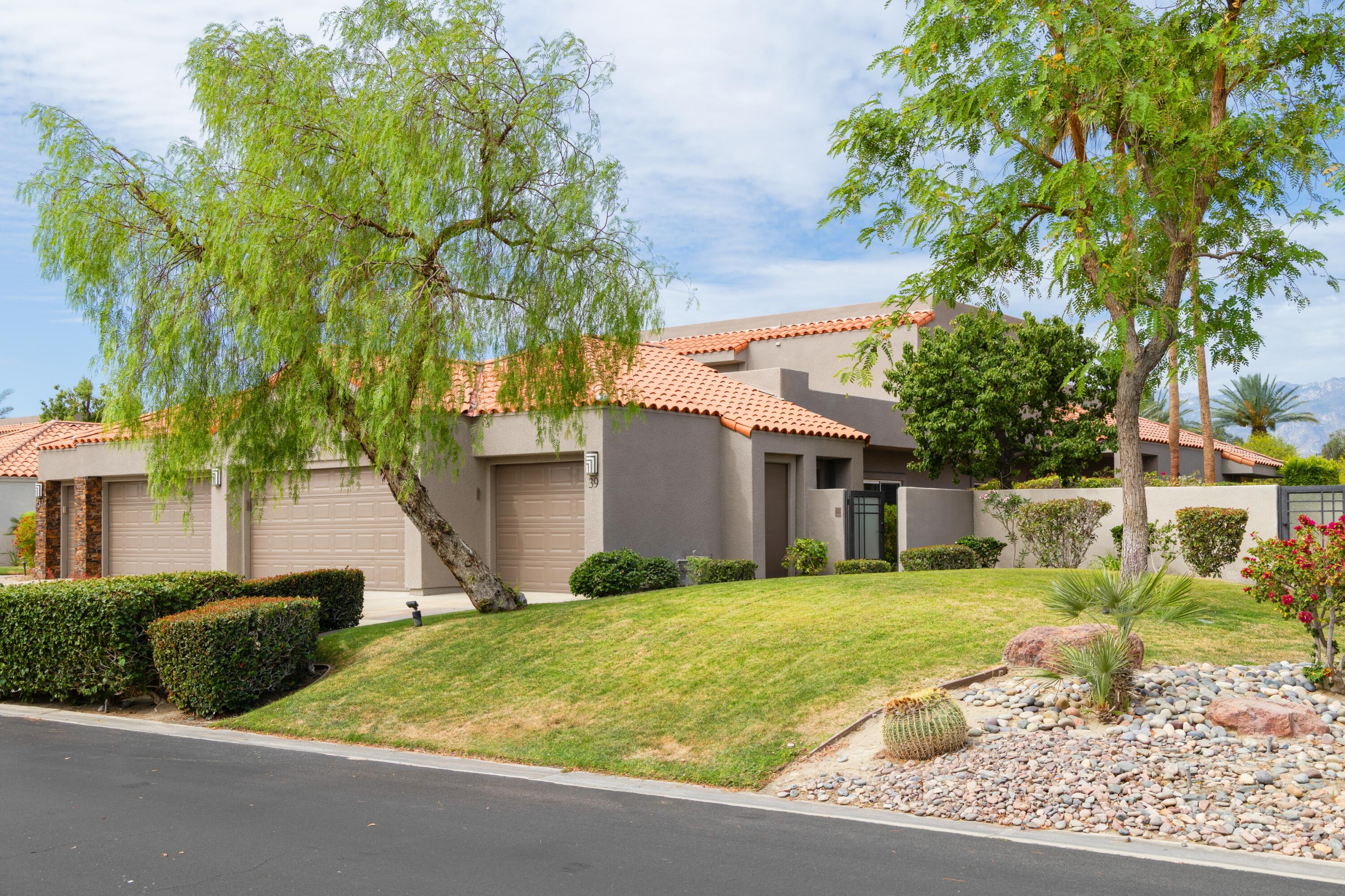 39 Augusta Drive Rancho Mirage, CA 92270 - Photo 2 of 53 a view of a house with a yard and large tree