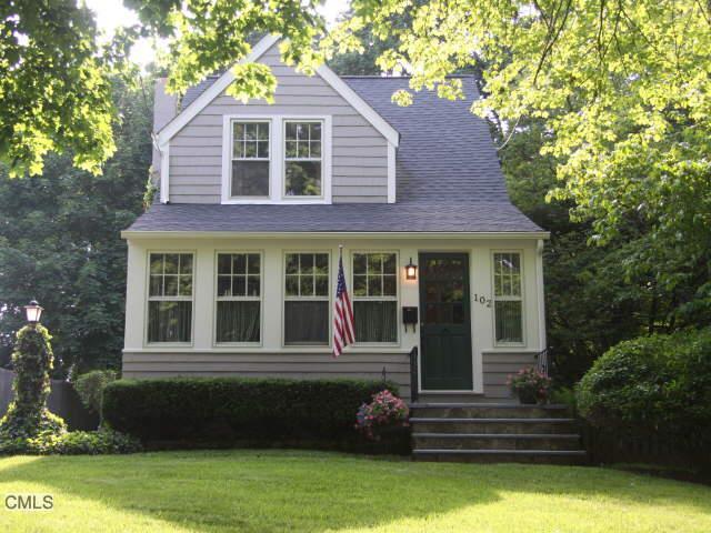 102 Spring Hill Avenue Norwalk, CT 06850 - Photo 1 of 1 a front view of a house with a yard