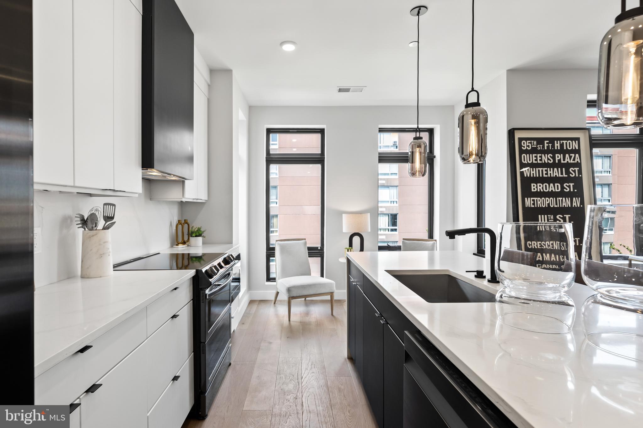 1208 M Street Northwest, Unit 61 Washington, DC 20005 - Photo 12 of 39 a kitchen with stainless steel appliances granite countertop a sink stove and refrigerator