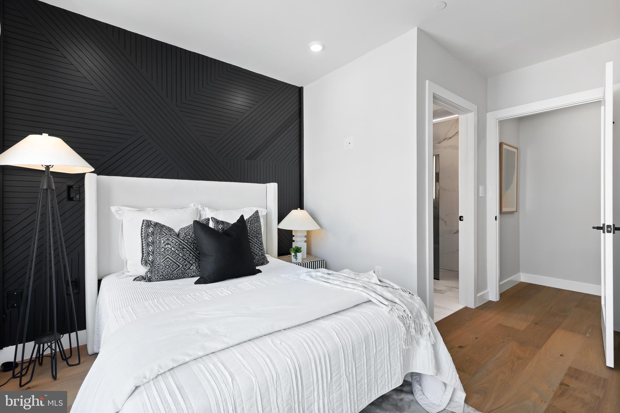 1208 M Street Northwest, Unit 61 Washington, DC 20005 - Photo 13 of 39 a bedroom with a bed and a night stand