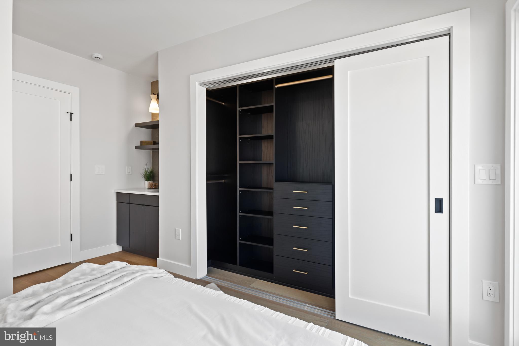 1208 M Street Northwest, Unit 61 Washington, DC 20005 - Photo 15 of 39 a bedroom with a bed and a closet