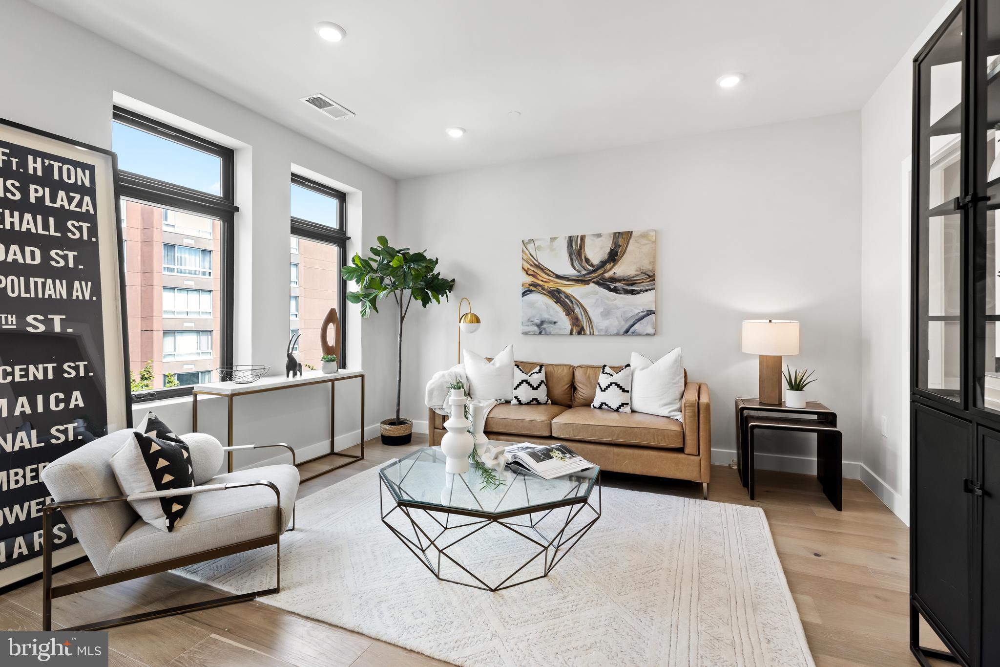 1208 M Street Northwest, Unit 61 Washington, DC 20005 - Photo 18 of 39 a living room with furniture and a large window