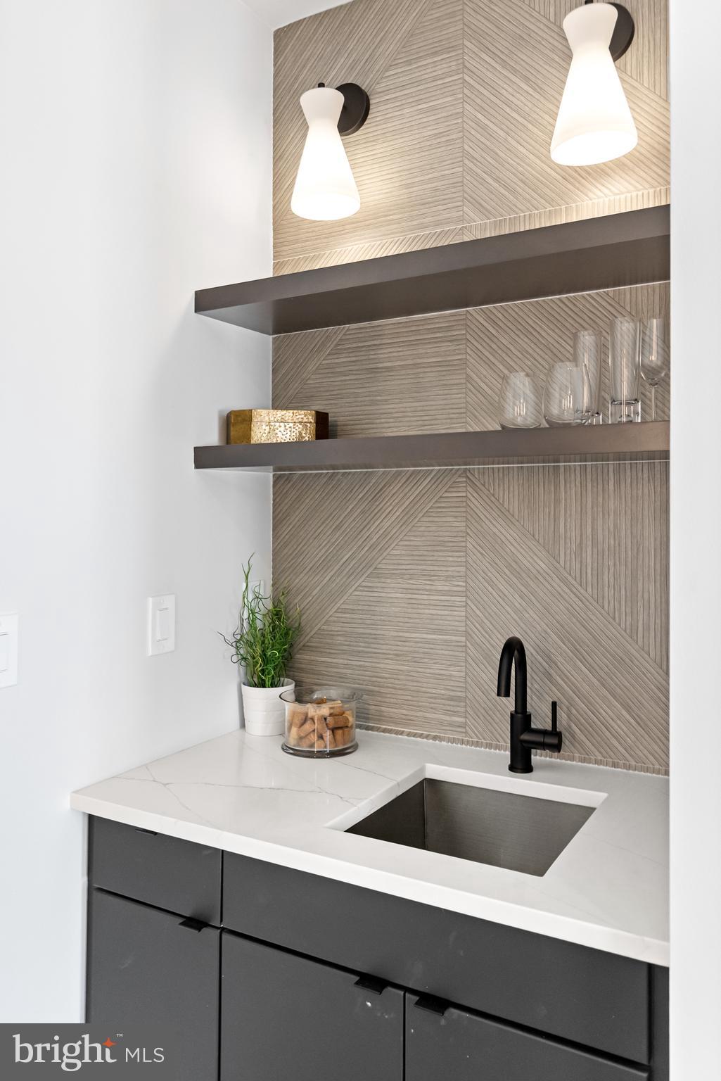 1208 M Street Northwest, Unit 61 Washington, DC 20005 - Photo 23 of 39 a kitchen with a sink and potted plant