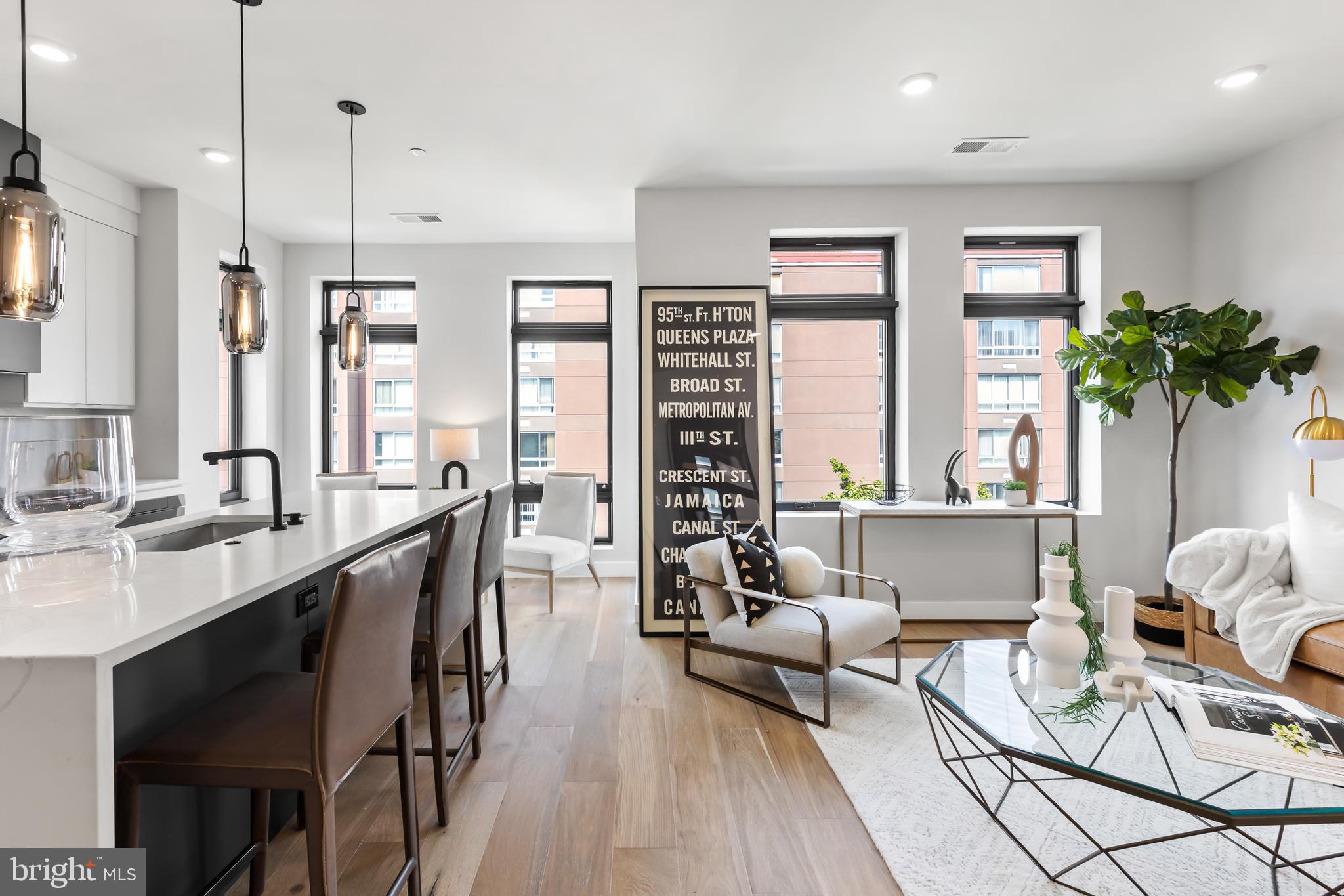 1208 M Street Northwest, Unit 61 Washington, DC 20005 - Photo 9 of 39 a living room with furniture a large window and a potted plant