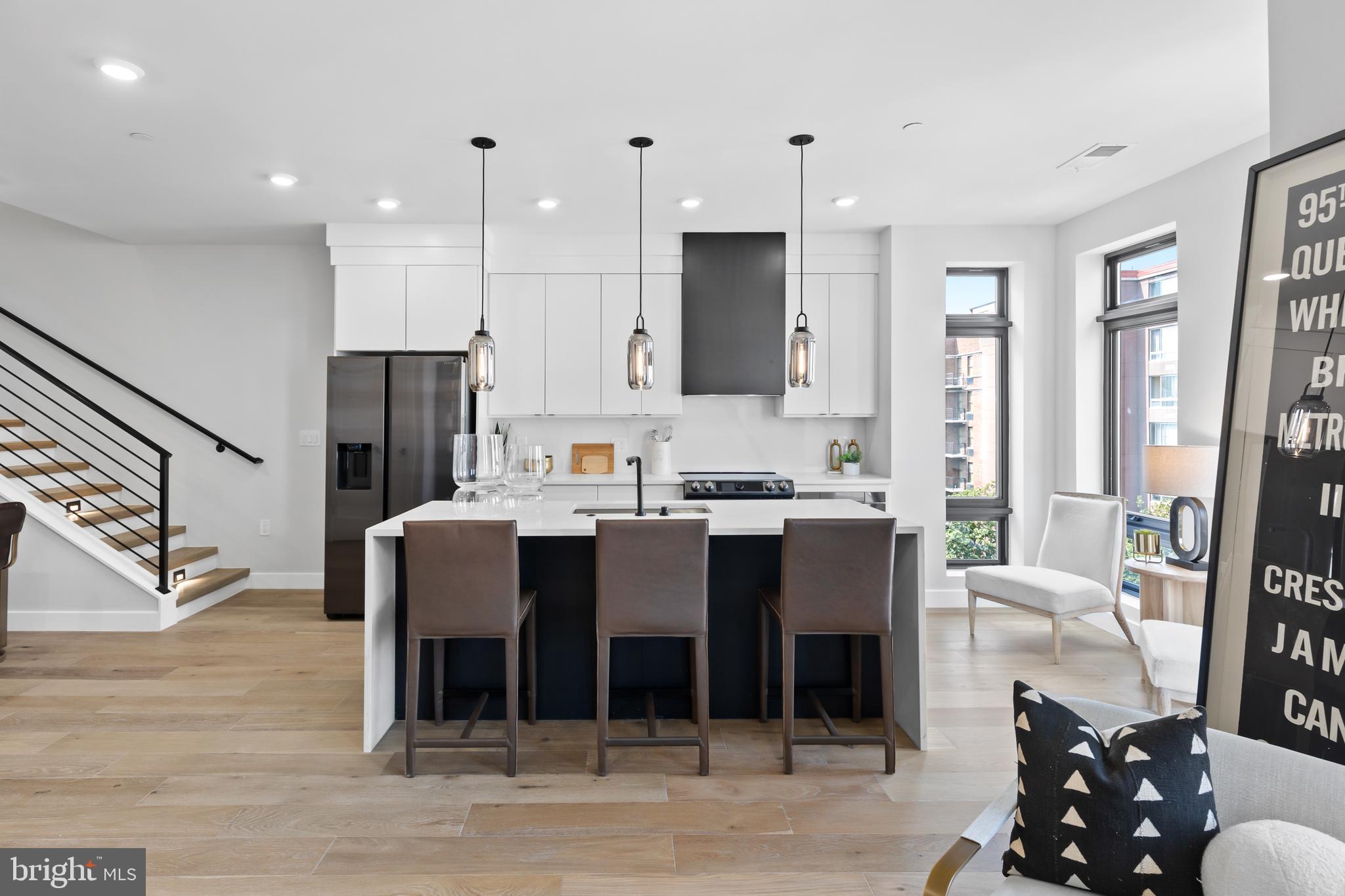 1208 M Street Northwest, Unit 61 Washington, DC 20005 - Photo 10 of 39 a large kitchen with a table and chairs