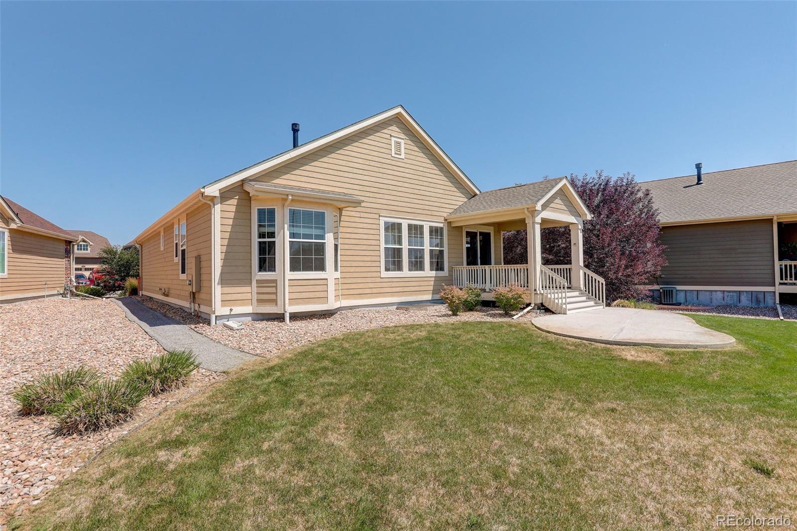 14747 Ulster Loop Thornton, CO 80602 - Photo 27 of 33 a view of a house with swimming pool and porch