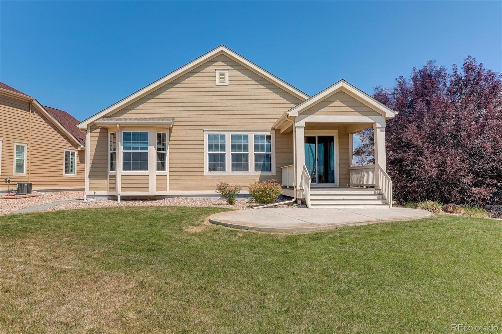 14747 Ulster Loop Thornton, CO 80602 - Photo 29 of 33 a view of a house with backyard and porch