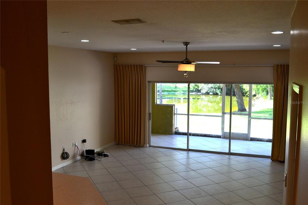 11235 Kapok Grand Circle Madeira Beach, FL 33708 - Photo 8 of 34 a view of an empty room with a window