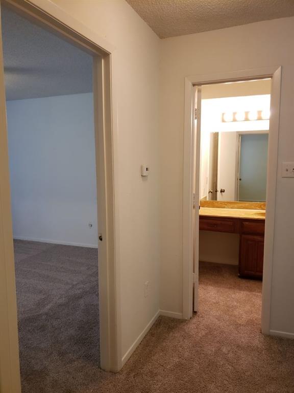 883 Waterfall Way Richardson, TX 75080 - Photo 15 of 26 a bathroom with a double vanity sink and a mirror