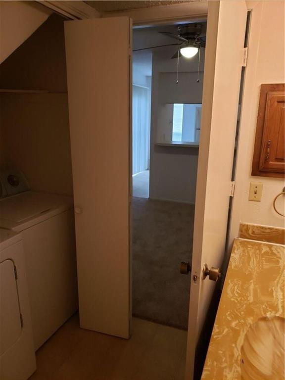 883 Waterfall Way Richardson, TX 75080 - Photo 16 of 26 a view of a hallway with wooden floor and a bathroom