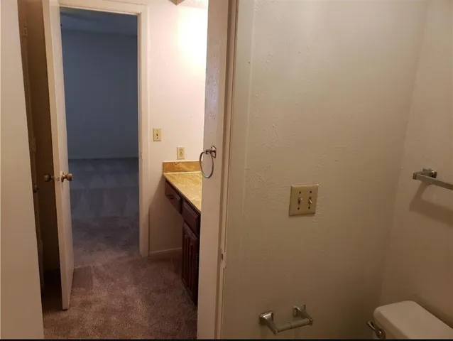 a bathroom with a sink and toilet