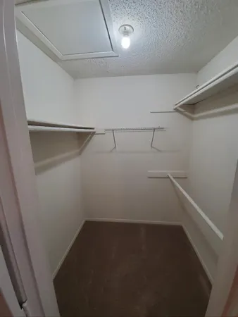 a view of a room with racks on the wall
