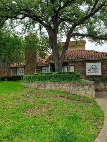 a view of house with backyard
