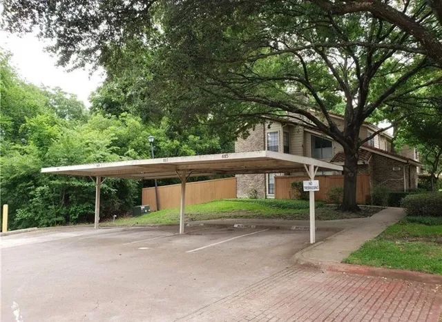 a view of house with a yard
