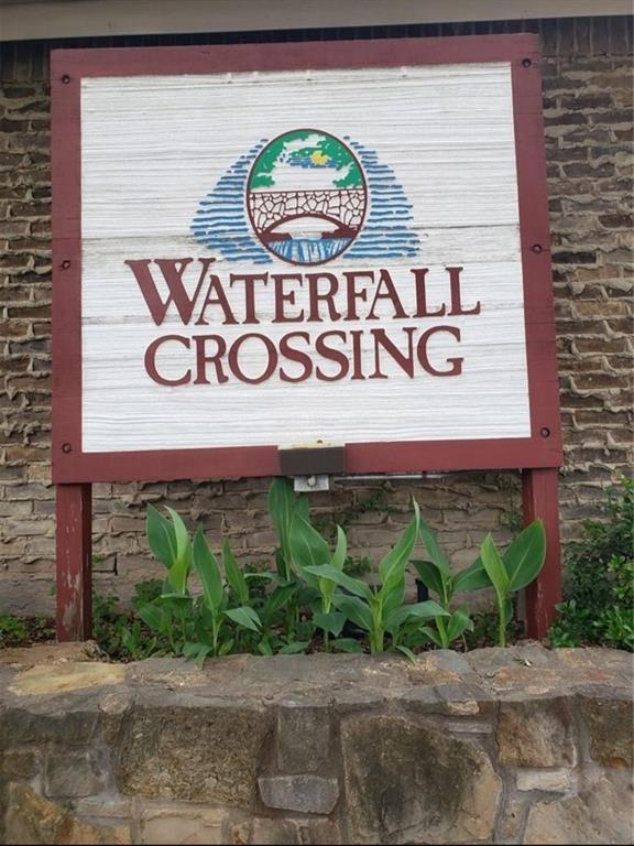 883 Waterfall Way Richardson, TX 75080 - Photo 26 of 26 a sign on a brick wall