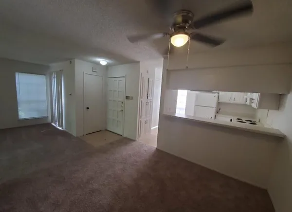 a view of a livingroom with natural light