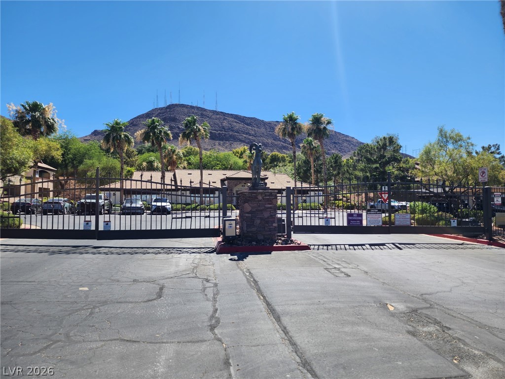 231 West Horizon Ridge Parkway, Unit 1127 Henderson, NV 89012 - Photo 4 of 39 Secure community entrance with iron gates and mountain vistas.