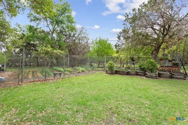 a view of a park with large trees