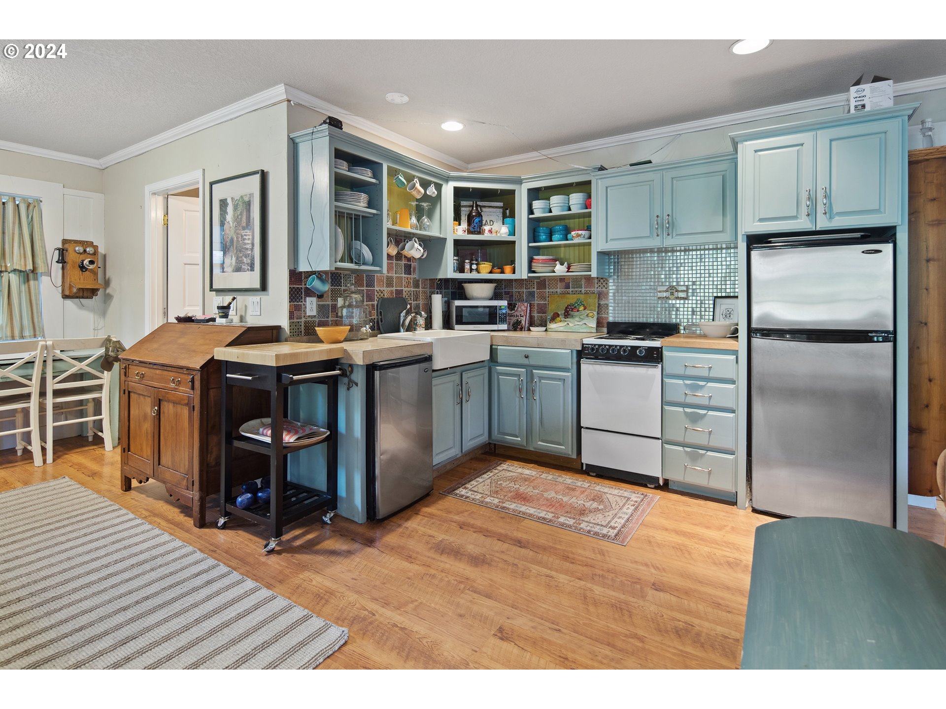 21545 Southwest Johnson Road West Linn, OR 97068 - Photo 26 of 43 a kitchen with stainless steel appliances granite countertop a sink and cabinets