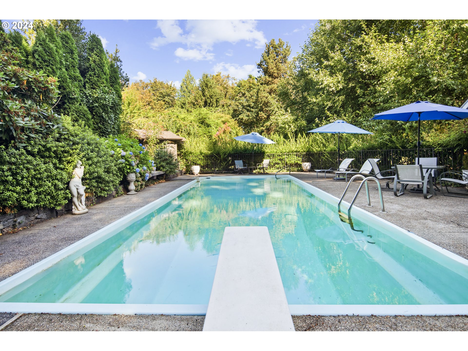 21545 Southwest Johnson Road West Linn, OR 97068 - Photo 30 of 43 a swimming pool with chairs