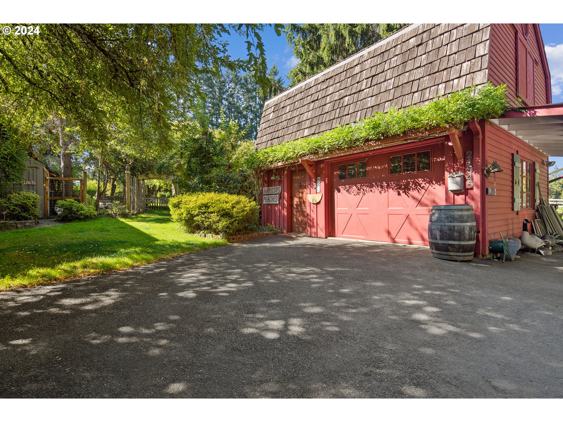 21545 Southwest Johnson Road West Linn, OR 97068 - Photo 38 of 43 a view of a backyard with a tree
