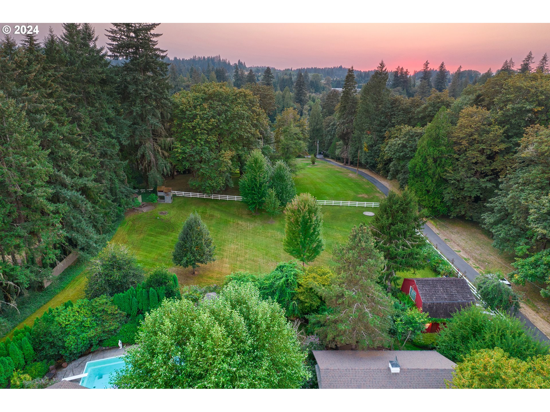 21545 Southwest Johnson Road West Linn, OR 97068 - Photo 42 of 43 a view of a lake with a mountain in the background