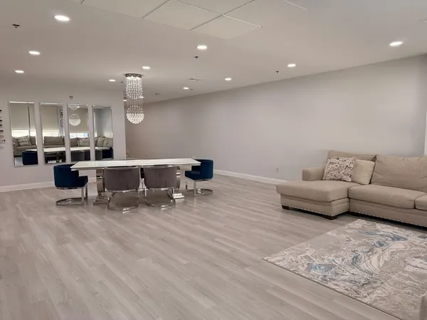 a living room with furniture and a table