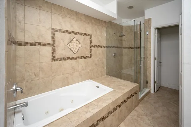 a bathroom with a tub and a shower