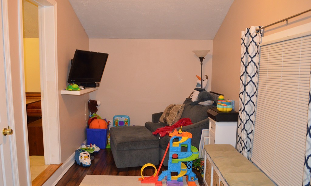 10 Falls Road Norton, MA 02766 - Photo 16 of 17 a children room with toys and a flat screen tv