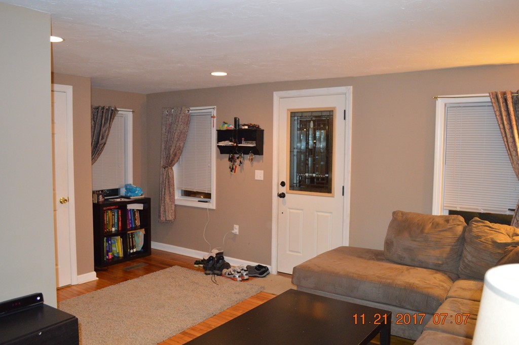 10 Falls Road Norton, MA 02766 - Photo 5 of 17 a living room with furniture and a wooden floor