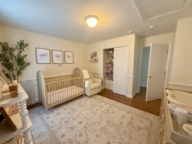 a bedroom with furniture and a window