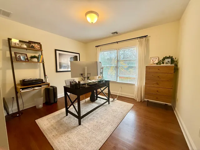 a living room with furniture rug and a window