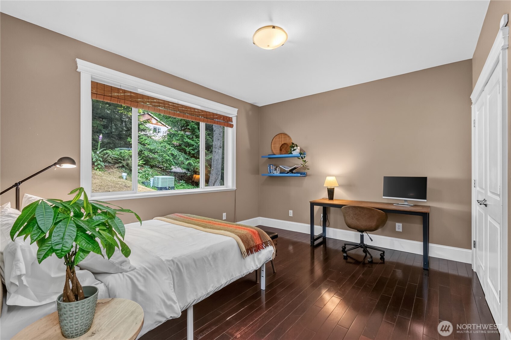 45 Cascade Lane Bellingham, WA 98229 - Photo 17 of 40 a bedroom with furniture and a potted plant