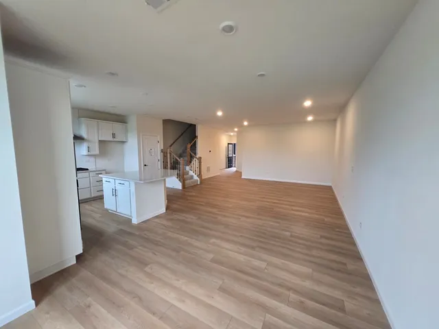 an empty room with wooden floor