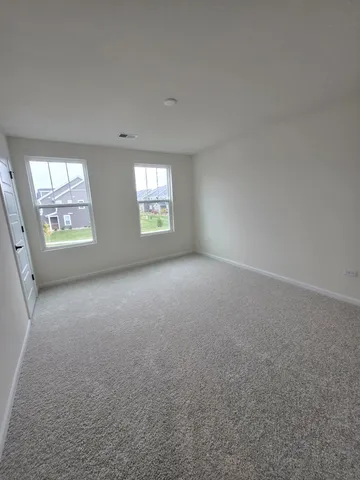 a bathroom with a double vanity sink and mirror