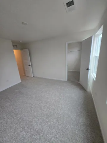 a bathroom with a toilet and a bathtub
