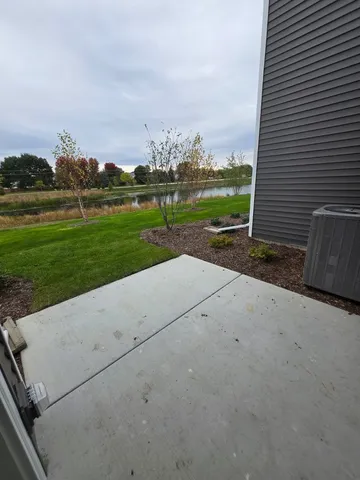 a view of a kitchen with a sink and a refrigerator