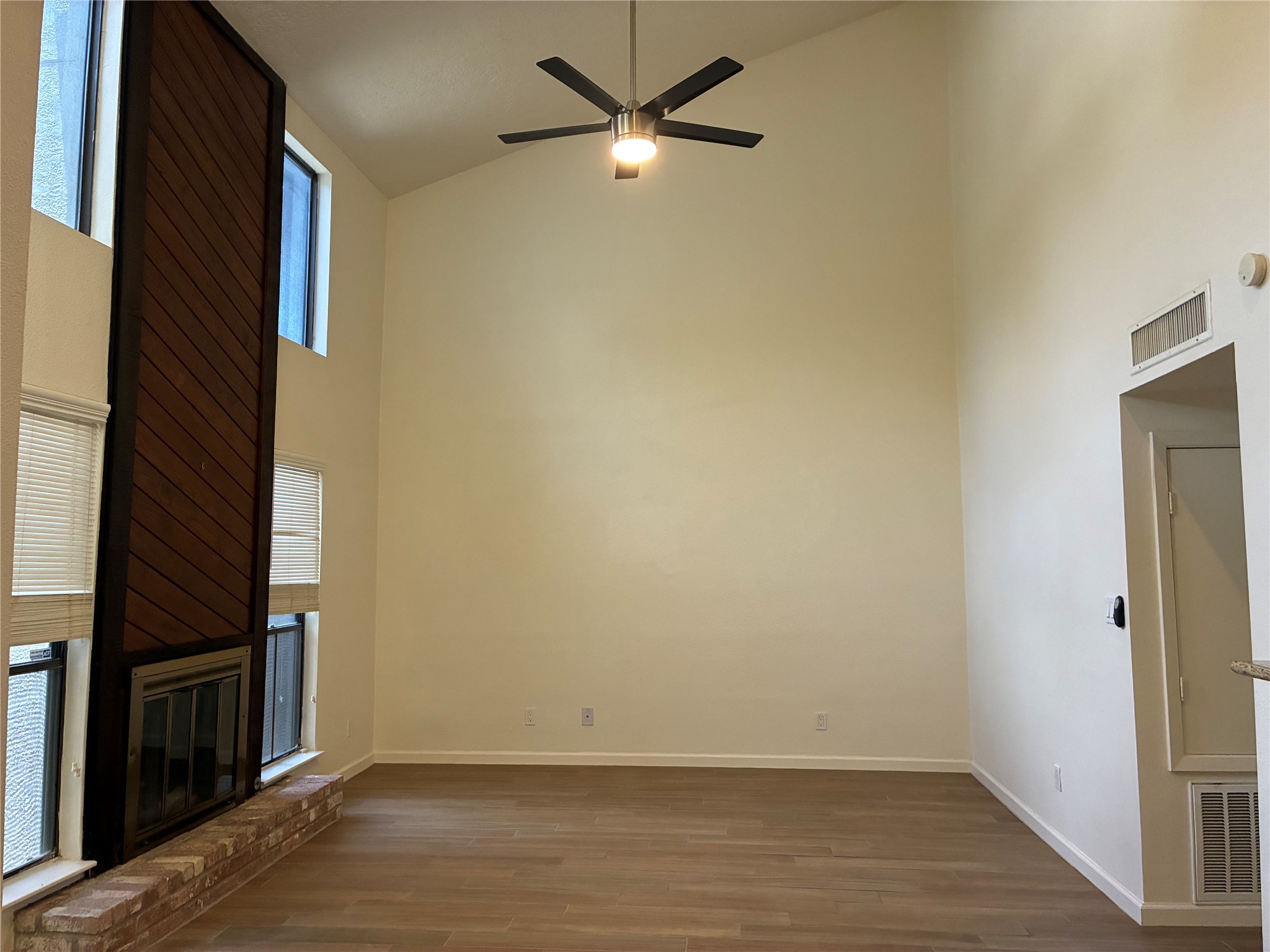6401 Deihl Road, Unit 1011 Houston, TX 77092 - Photo 4 of 16 a view of an empty room with wooden floor and a window