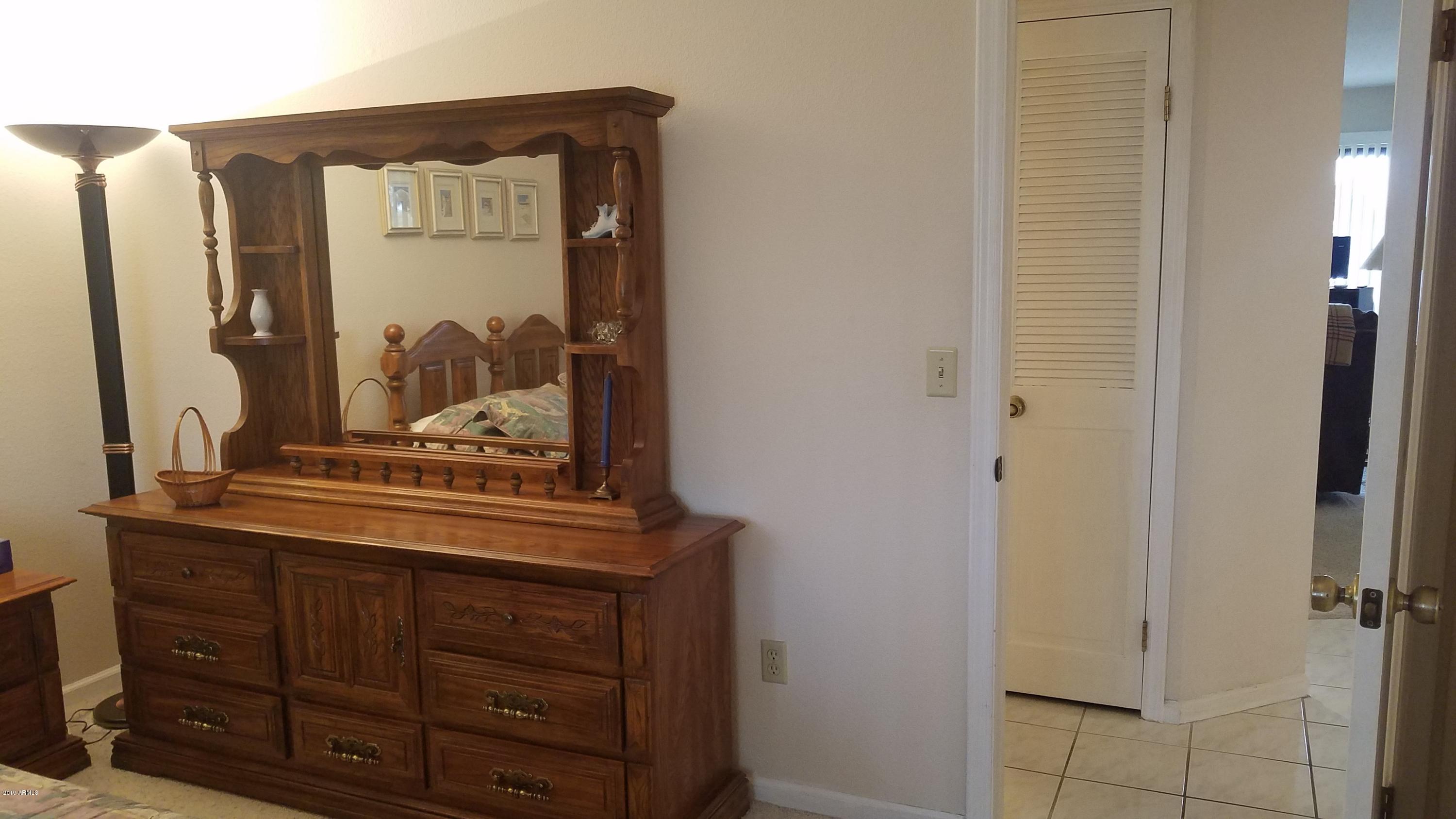 7061 East Broadway Road, Unit 48 Mesa, AZ 85208 - Photo 19 of 41 a view of a dresser
