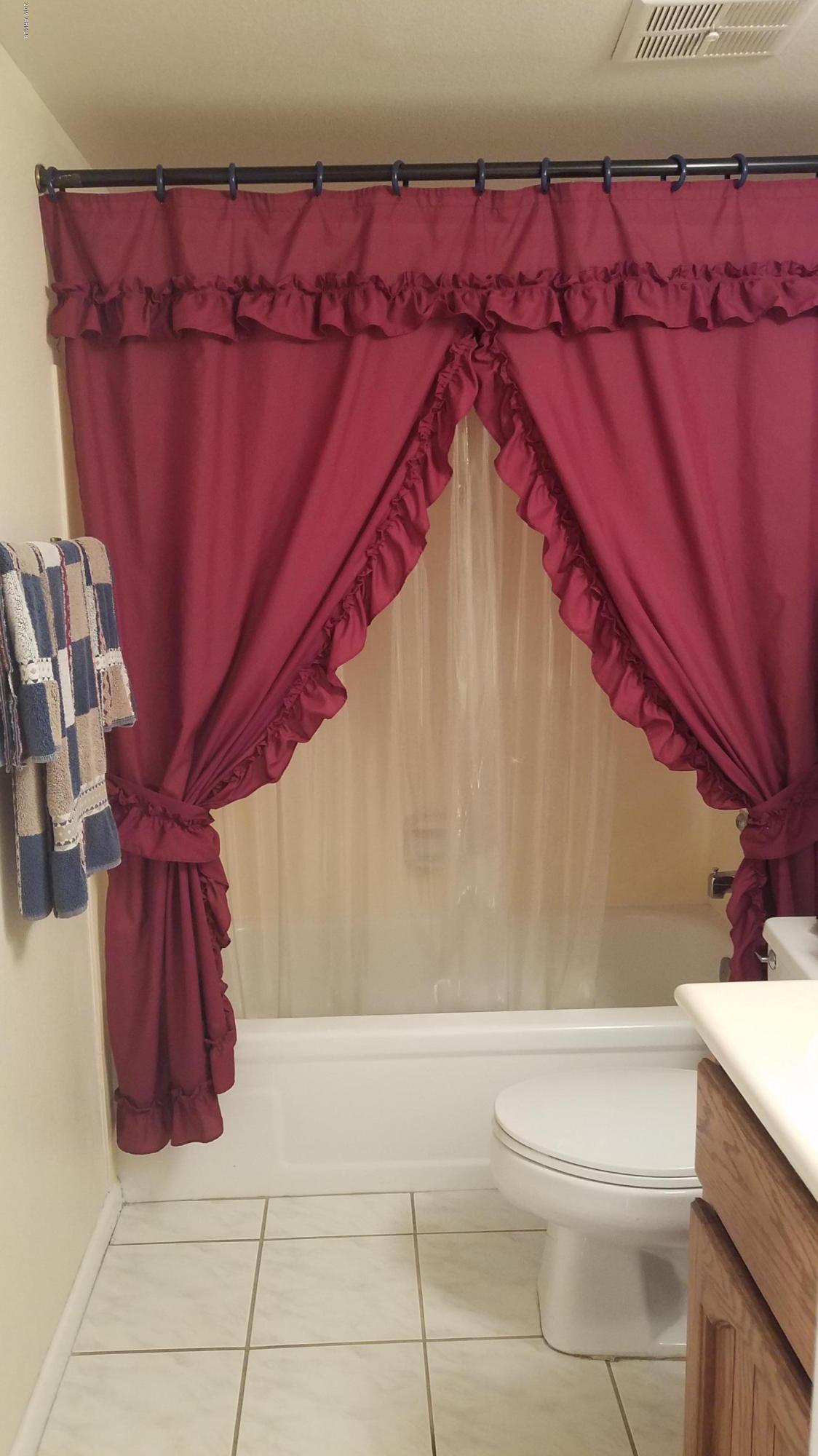 7061 East Broadway Road, Unit 48 Mesa, AZ 85208 - Photo 23 of 41 a bathroom with a bathtub and shower